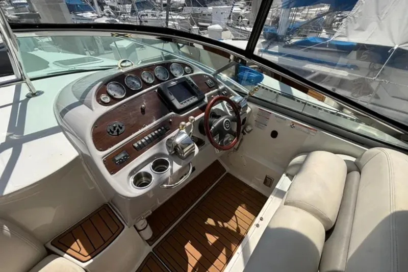 Slide: The Image of 2007 Chaparral Signature 350 boat helm with wood accents and modern controls. - 5