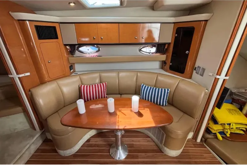 Slide: The Image of Luxurious 2007 Chaparral Signature 350 yacht interior with leather seating and wooden table. - 7