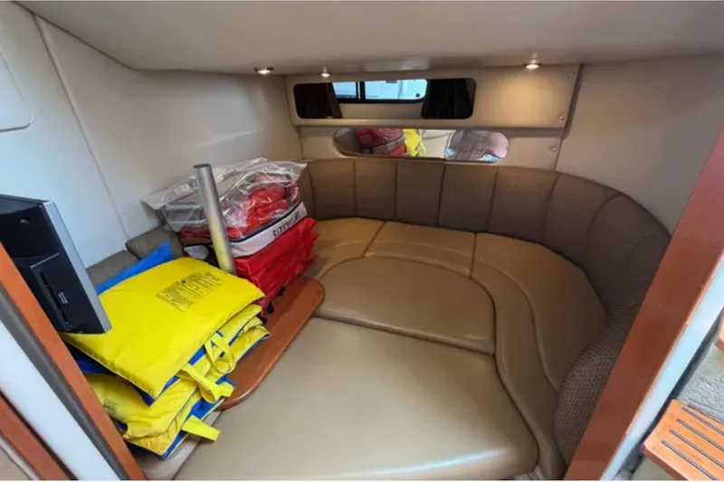 Slide: The Image of Interior of 2007 Chaparral Signature 350 boat with life jackets and cozy seating area. - 9