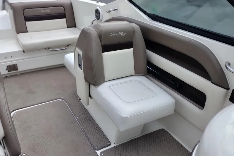 Slide: The Image of Interior of a 2013 Sea Ray 300 SLX boat with beige and white seating. - 13