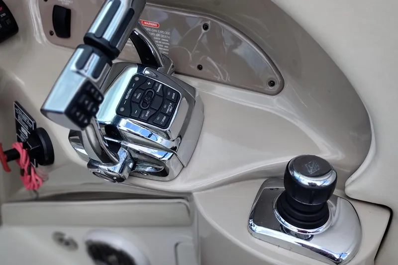 Slide: The Image of 2013 Sea Ray 300 SLX boat controls with chrome throttle and joystick. - 20
