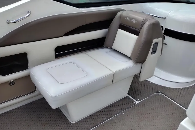 Slide: The Image of 2013 Sea Ray 300 SLX boat interior with beige and brown seating. - 26