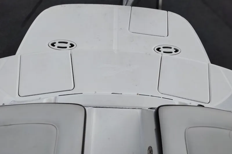 Slide: The Image of Rear deck of a 2013 Sea Ray 300 SLX boat, featuring storage compartments. - 29