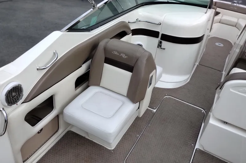 Slide: The Image of Interior of a 2013 Sea Ray 300 SLX boat, featuring beige and white seating. - 33