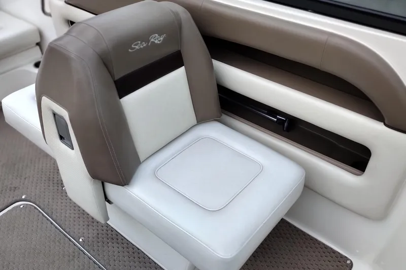 Slide: The Image of 2013 Sea Ray 300 SLX boat seat with beige and white upholstery. - 37
