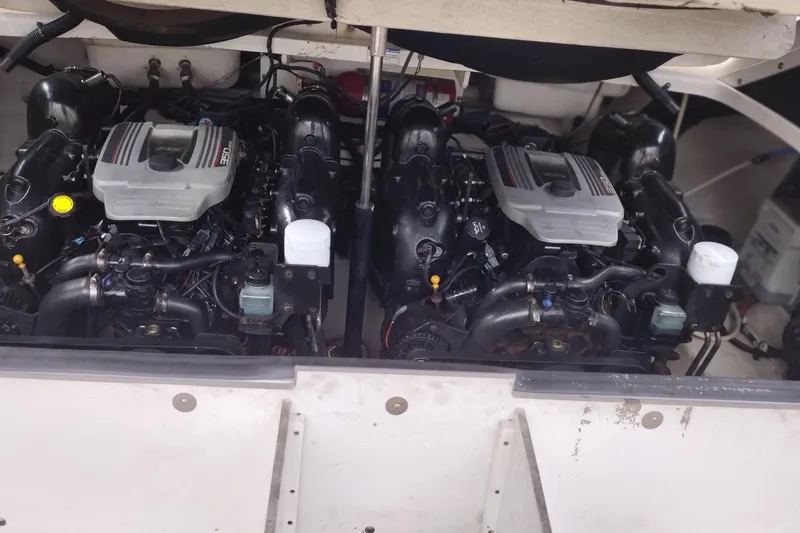 Slide: The Image of Twin engines of a 2013 Sea Ray 300 SLX boat, showcasing detailed mechanics. - 38