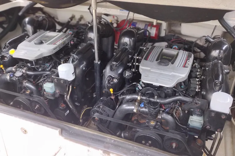 Slide: The Image of Twin engines of a 2013 Sea Ray 300 SLX boat, showcasing detailed mechanical components. - 39