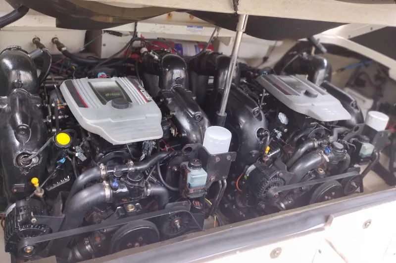 Slide: The Image of Engine compartment of a 2013 Sea Ray 300 SLX boat, showcasing dual engines. - 40