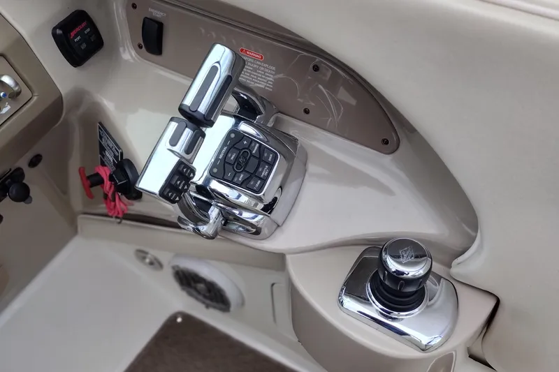 Slide: The Image of Control panel of a 2013 Sea Ray 300 SLX boat with chrome throttle and joystick. - 41