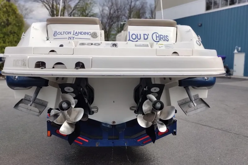 Slide: The Image of Rear view of a 2013 Sea Ray 300 SLX boat with dual propellers. - 7