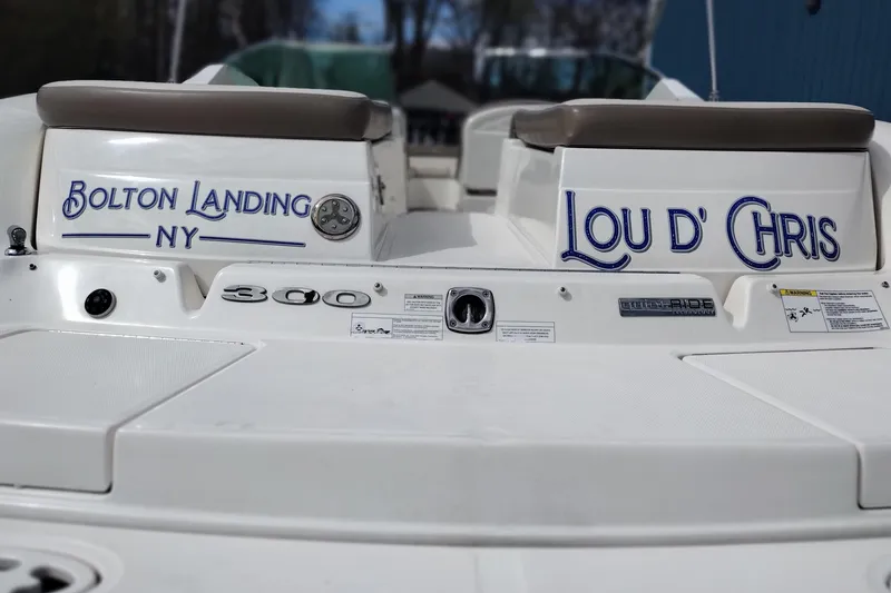 Slide: The Image of 2013 Sea Ray 300 SLX boat with "Bolton Landing NY" and "Lou D' Chris" text. - 9