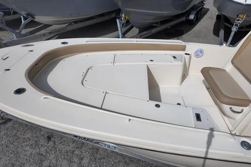 Slide: The Image of 2021 Scout 251 XSS boat interior with seating and storage compartments. - 14
