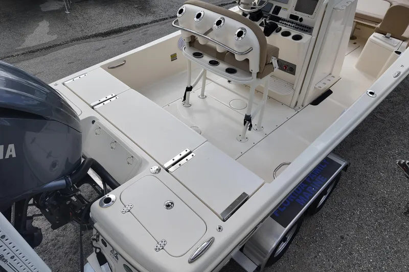 Slide: The Image of 2021 Scout 251 XSS boat interior with Yamaha engine, featuring helm and seating area. - 3