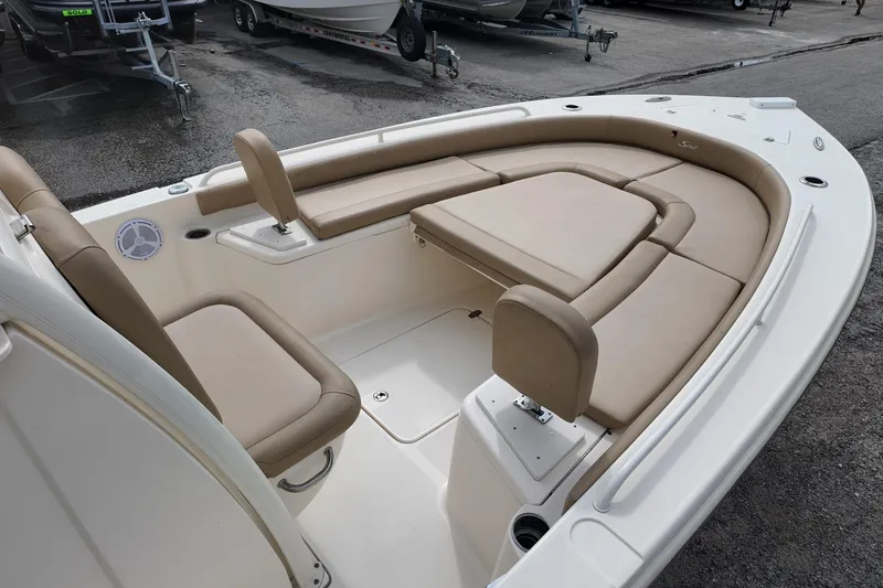 Slide: The Image of 2021 Scout 251 XSS boat interior with beige seating and spacious layout. - 7