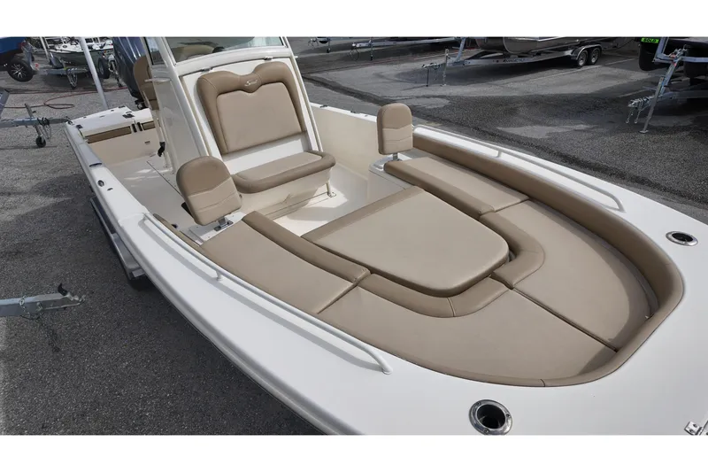 Slide: The Image of 2021 Scout 251 XSS boat interior with beige seating and spacious layout. - 8