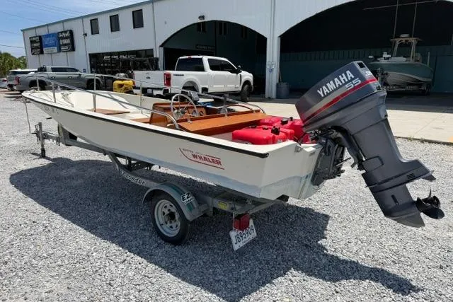 Slide: The Image of 1984 Boston Whaler 150 Sport boat with Yamaha outboard motor on trailer. - 4