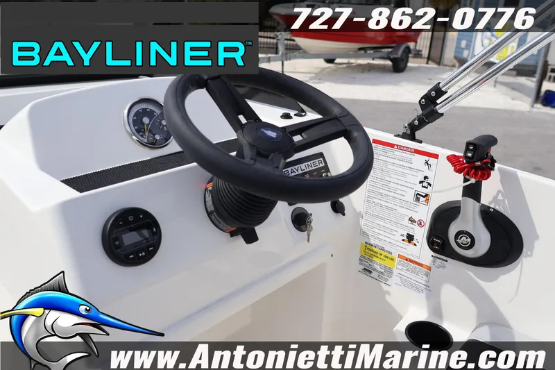 Slide: The Image of 2026 Bayliner Element M17 boat dashboard with steering wheel and controls, featuring Antonietti Marine branding. - 14