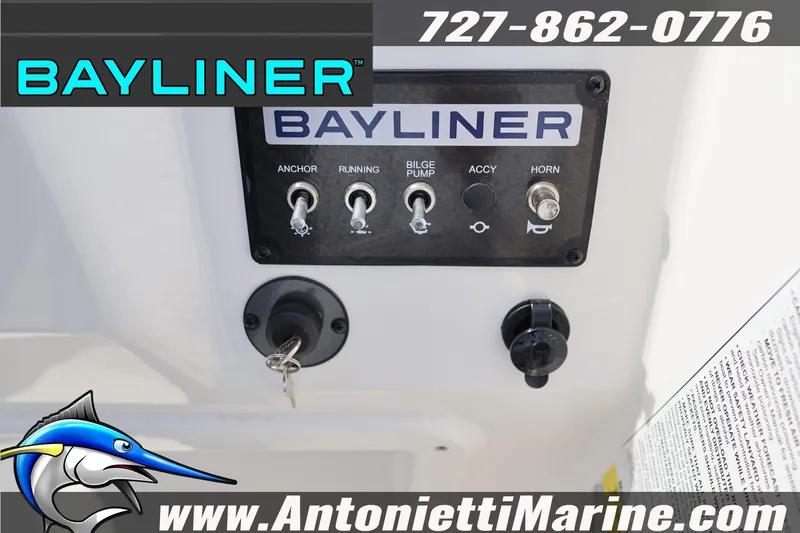 Slide: The Image of Control panel of 2026 Bayliner Element M17 boat with switches and key ignition. - 17