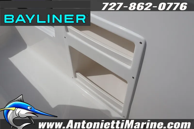 Slide: The Image of 2026 Bayliner Element M17 boat detail with storage compartments, contact info, and logo. - 20