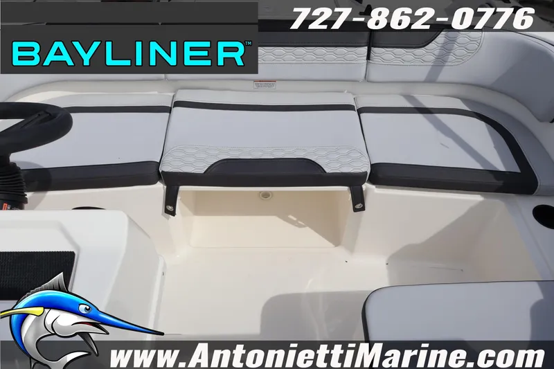 Slide: The Image of 2026 Bayliner Element M17 boat interior with seating, logo, and contact details. - 24