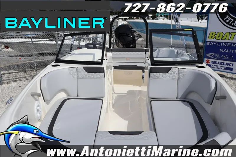 Slide: The Image of 2026 Bayliner Element M17 boat interior with seating, windshield, and marine branding. - 6