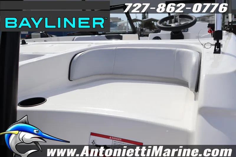 Slide: The Image of 2026 Bayliner Element M17 boat interior with seating, steering wheel, and branding details. - 8