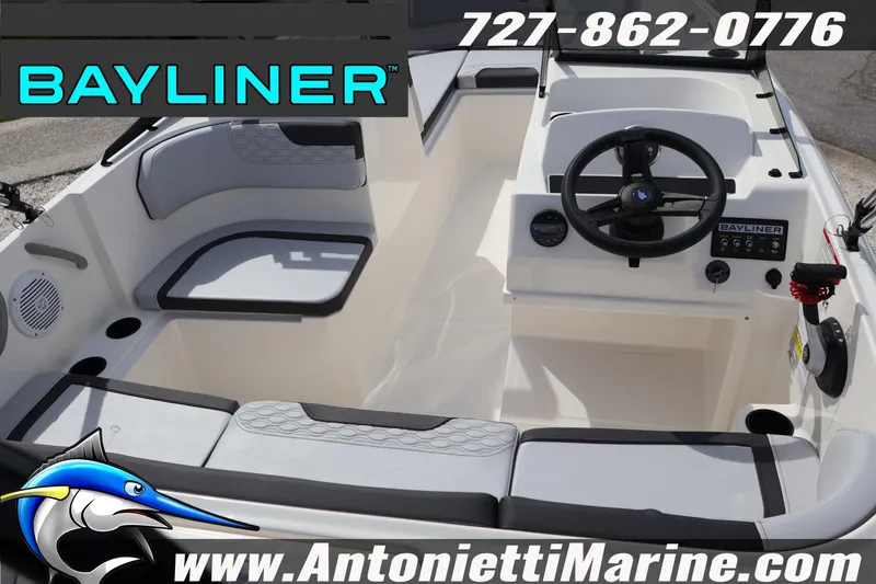 Slide: The Image of 2026 Bayliner Element M17 boat interior with steering wheel and seating, Antonietti Marine branding. - 9