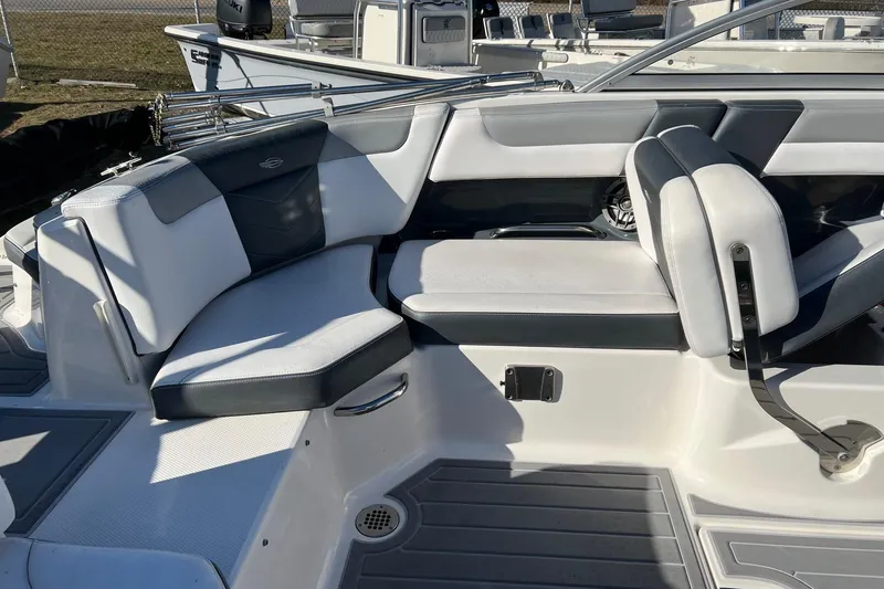 Slide: The Image of 2021 Chaparral 230 Suncoast boat interior with sleek seating and modern design. - 17