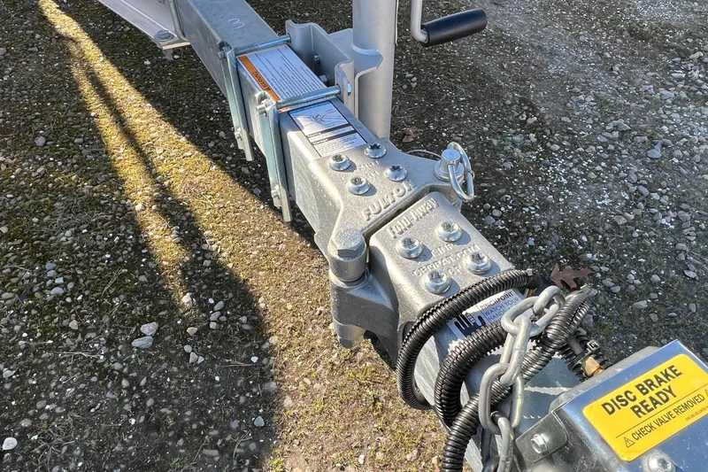 Slide: The Image of Trailer hitch of a 2021 Chaparral 230 Suncoast boat, featuring disc brake readiness. - 36