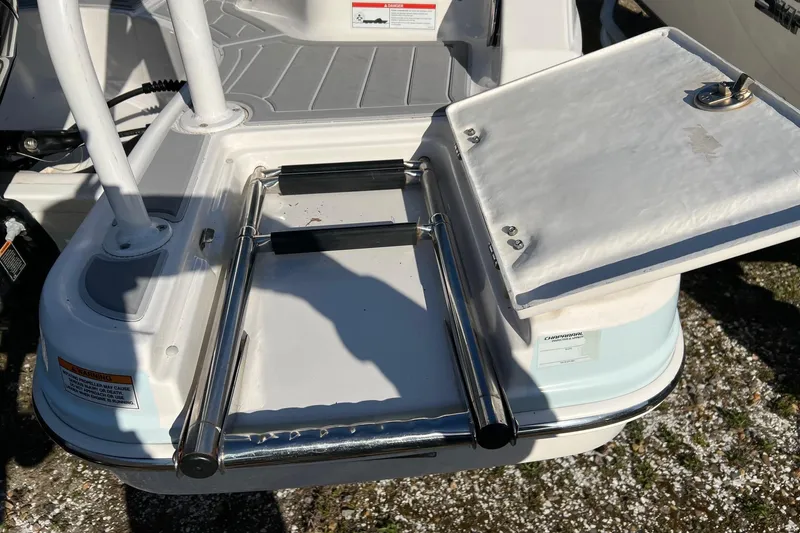 Slide: The Image of 2021 Chaparral 230 Suncoast boat ladder and swim platform detail. - 7