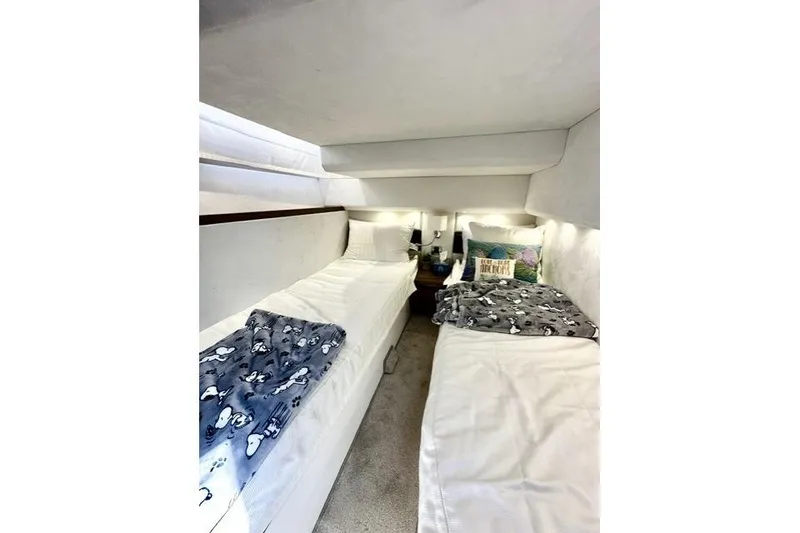 Slide: The Image of Interior cabin of 2018 Galeon 420 Fly yacht with twin beds and cozy decor. - 11