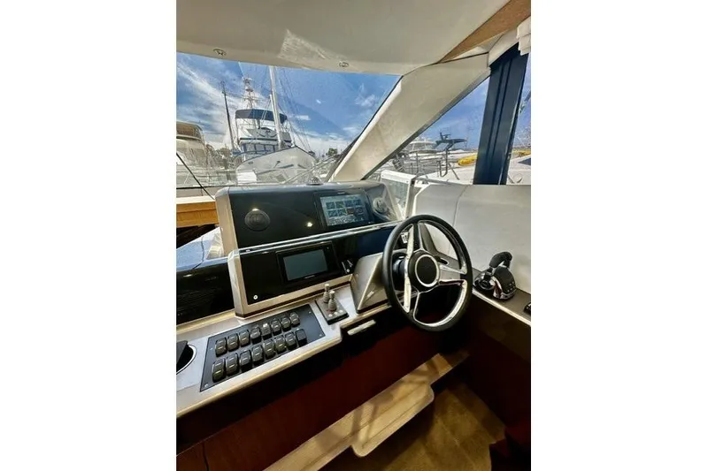 Slide: The Image of Helm of 2018 Galeon 420 Fly yacht with modern controls and navigation system. - 12