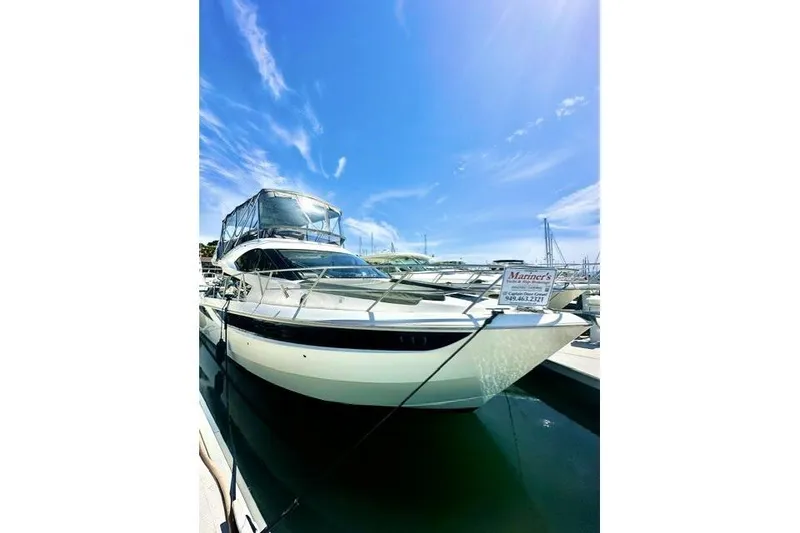 Slide: The Image of 2018 Galeon 420 Fly yacht docked under a clear blue sky. - 16