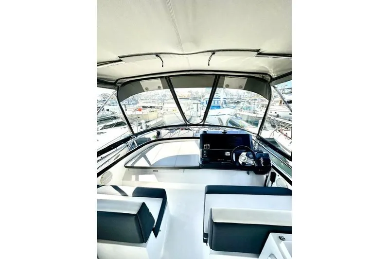 Slide: The Image of Flybridge view of 2018 Galeon 420 Fly yacht, showcasing helm and seating area. - 3