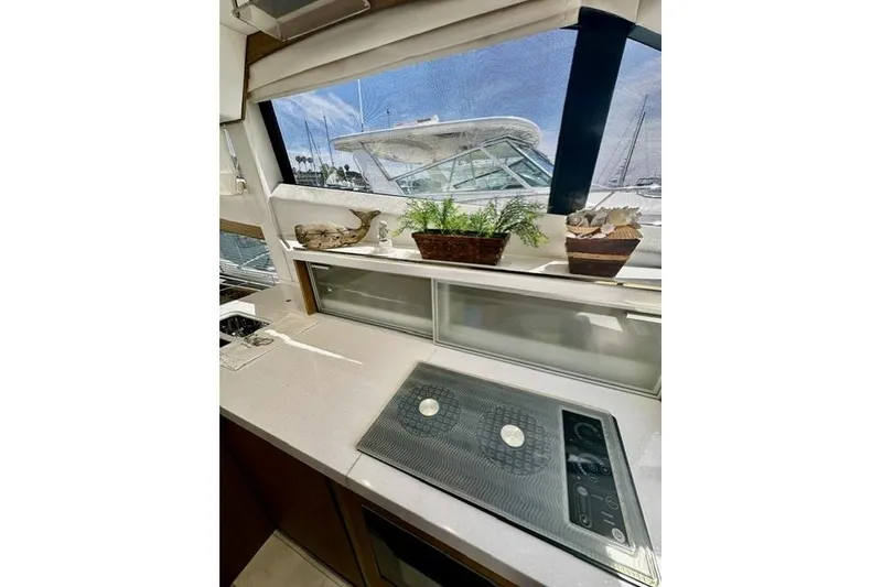 Slide: The Image of Modern kitchen interior of 2018 Galeon 420 Fly yacht with stove and decorative plants. - 7