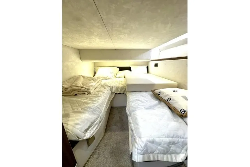 Slide: The Image of Cozy cabin interior of 2018 Galeon 420 Fly yacht with twin beds and soft lighting. - 9