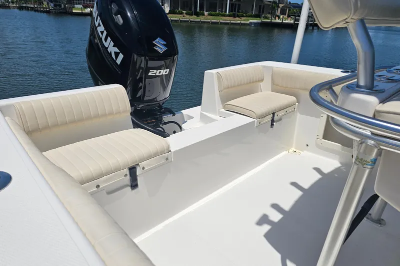Slide: The Image of 2005 Mako 212 Center Console boat with Suzuki 200 engine, featuring beige seating. - 15