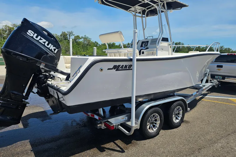 Slide: The Image of 2005 Mako 212 Center Console boat on trailer with Suzuki outboard motor. - 2