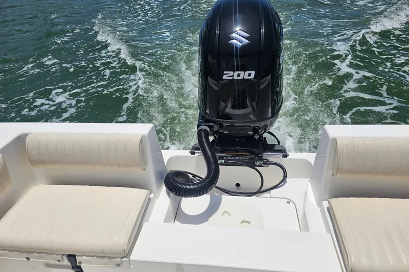 Slide: The Image of 2005 Mako 212 Center Console boat with Suzuki 200 outboard motor on water. - 25