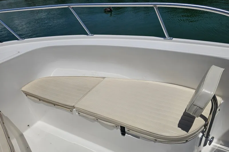 Slide: The Image of 2005 Mako 212 Center Console boat with cushioned seating and stainless steel railing. - 27