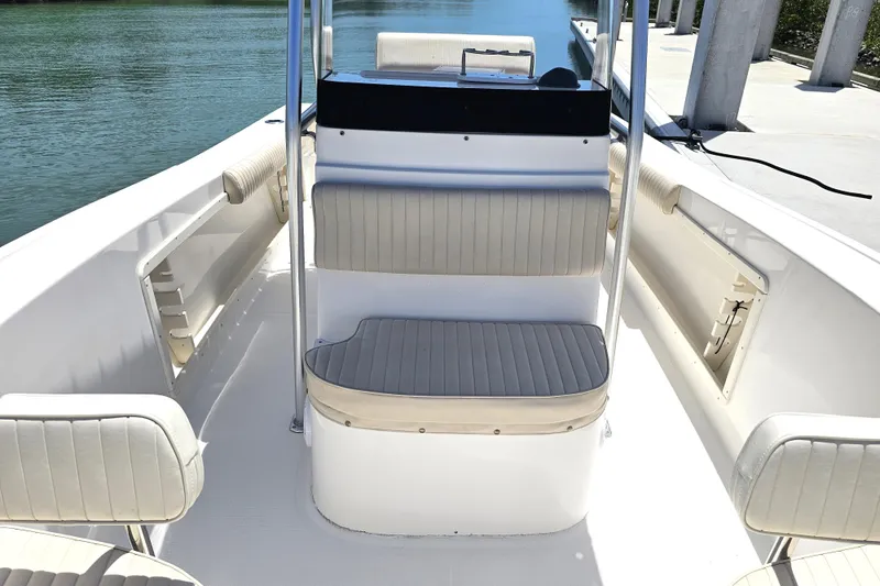 Slide: The Image of 2005 Mako 212 Center Console boat interior with seating and console view. - 30
