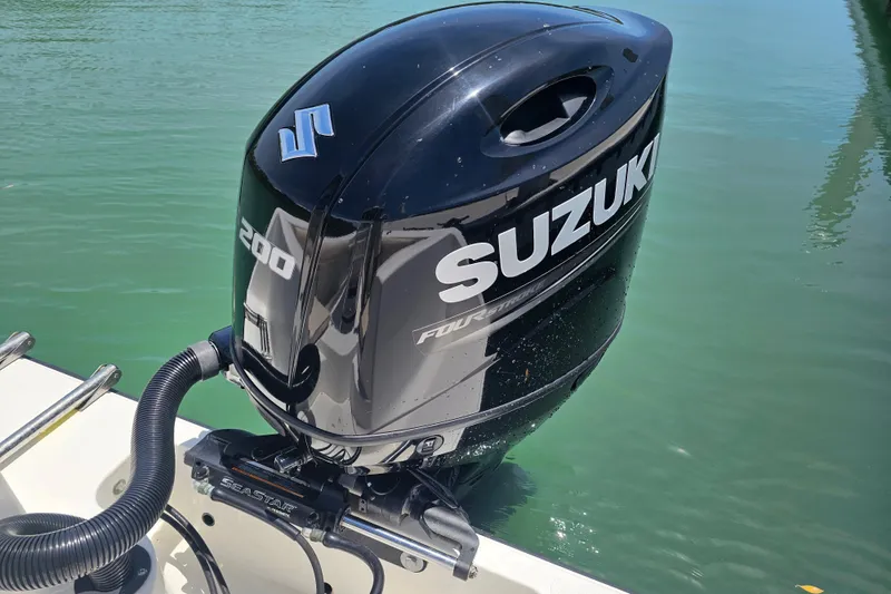 Slide: The Image of Suzuki 200 outboard motor on a 2005 Mako 212 Center Console boat. - 36