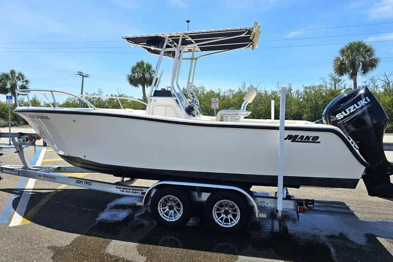 Slide: The Image of 2005 Mako 212 Center Console boat on trailer with Suzuki outboard motor. - 4