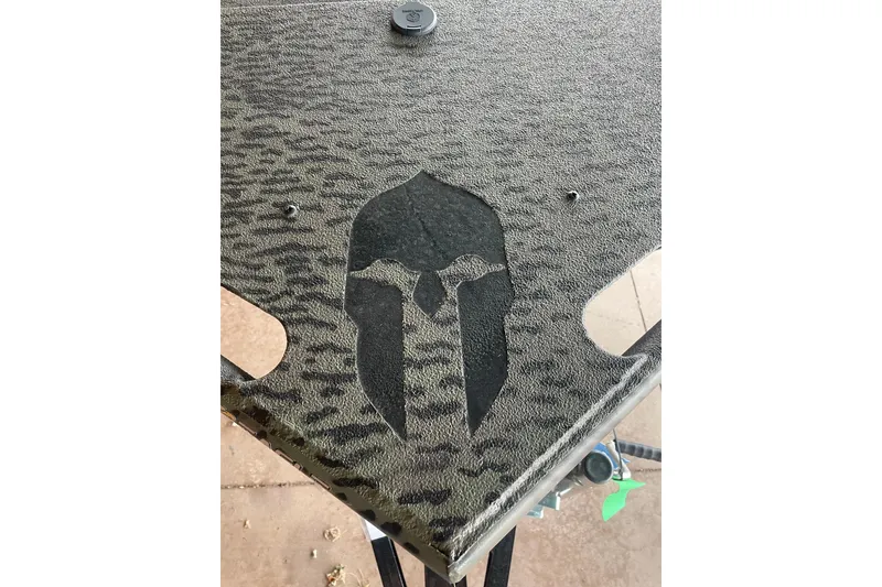 Slide: The Image of Textured surface with Spartan helmet design on War Eagle 750 Gladiator, 2026 model. - 10
