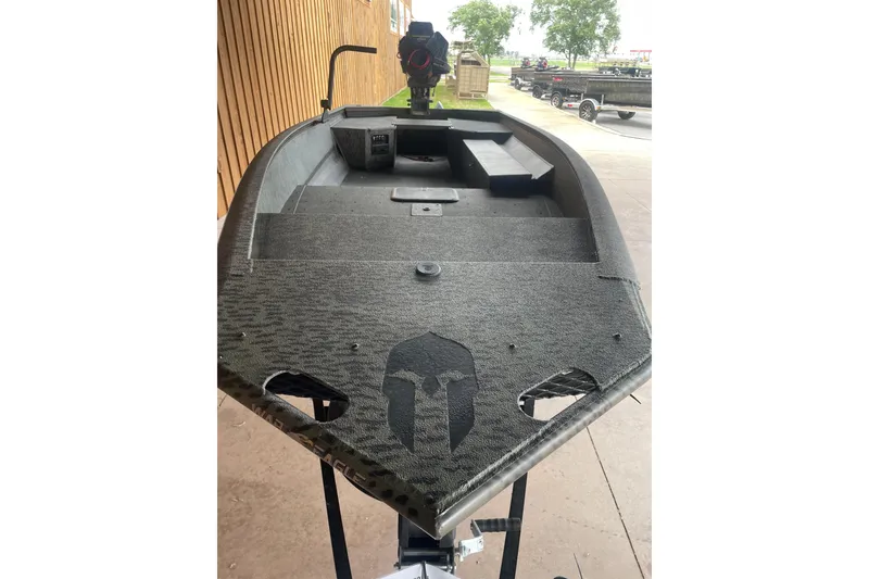 Slide: The Image of 2026 War Eagle 750 Gladiator boat with camouflage design and Spartan helmet graphic. - 11