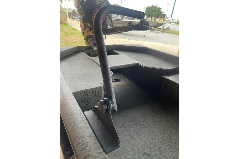 Slide: The Image of Interior view of 2026 War Eagle 750 Gladiator boat, featuring a sturdy handle and textured flooring. - 12