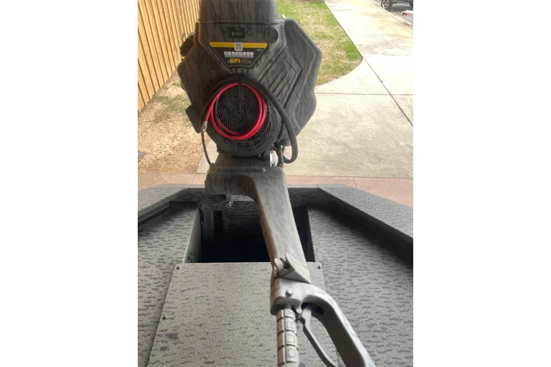 Slide: The Image of 2026 War Eagle 750 Gladiator boat with advanced motor and textured flooring. - 13