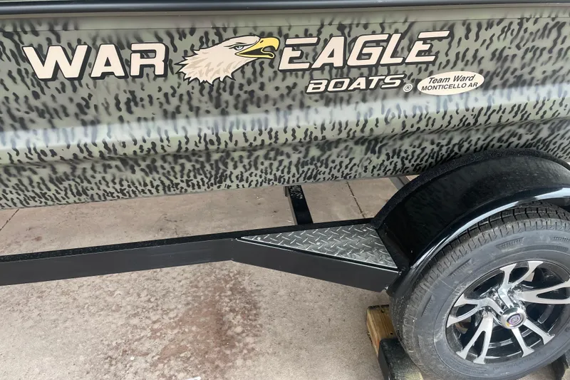 Slide: The Image of War Eagle 750 Gladiator 2026 boat trailer with camo design and branded logo. - 5