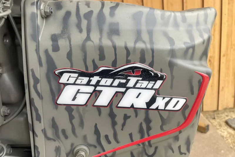 Slide: The Image of Camouflage-patterned GatorTail GTR XD engine cover on War Eagle 750 Gladiator, 2026 model. - 7