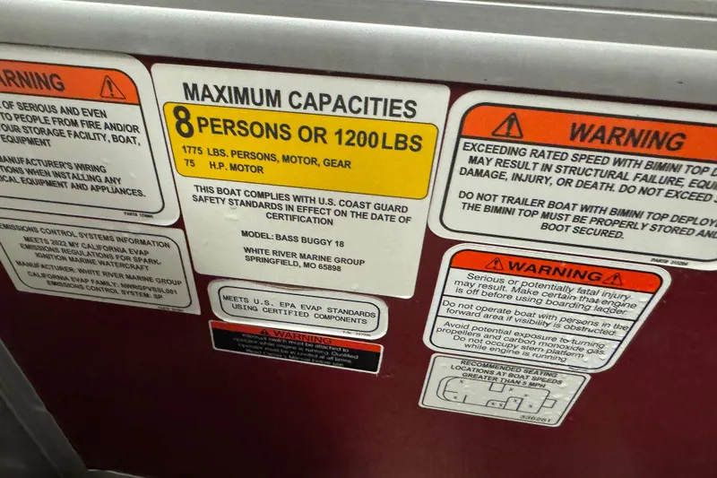 Slide: The Image of 2022 Sun Tracker Bass Buggy 18 DLX capacity and warning labels, maximum 8 persons or 1200 lbs. - 11